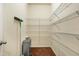 Walk-in pantry with ample shelving and storage space for an organized kitchen at 8008 Hergety Dr, Raleigh, NC 27603