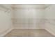 Spacious walk-in closet featuring carpet and wire shelving for optimal storage and organization at 8008 Hergety Dr, Raleigh, NC 27603