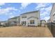 Fenced backyard with a manicured lawn and view of the home's exterior at 824 Wrights Creek Way, Wake Forest, NC 27587