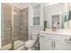 Bathroom featuring tiled walk-in shower, toilet, and vanity with white cabinets and sink at 824 Wrights Creek Way, Wake Forest, NC 27587
