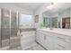 Bathroom features a shower, tub, vanity, large mirror, and neutral color palette at 824 Wrights Creek Way, Wake Forest, NC 27587