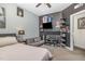 Unique bedroom with customized shelving, a comfortable futon, and a ceiling fan at 824 Wrights Creek Way, Wake Forest, NC 27587