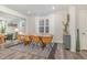 The dining room features modern furnishings and natural light with views into the living room at 824 Wrights Creek Way, Wake Forest, NC 27587