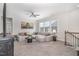 Bright living room with a comfortable sectional sofa, accent tables, and neutral decor at 824 Wrights Creek Way, Wake Forest, NC 27587