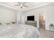 Spacious main bedroom with ensuite bathroom access and TV at 824 Wrights Creek Way, Wake Forest, NC 27587