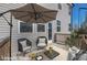 Inviting deck with comfortable seating, a stylish umbrella, and a relaxing outdoor space perfect for entertaining at 90 Rigsby Ave, Four Oaks, NC 27524