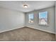 Unfurnished bedroom filled with natural light from dual windows, perfect for personalization at 90 Rigsby Ave, Four Oaks, NC 27524
