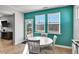 Cozy dining area with a view of the backyard, flooded with natural light from the large windows at 90 Rigsby Ave, Four Oaks, NC 27524