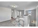 Cozy upstairs loft area is staged with comfortable seating, a bright window, and neutral-toned decor at 90 Rigsby Ave, Four Oaks, NC 27524