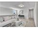 Inviting upstairs loft is staged as a bonus room with soft textures and neutral decor that makes the space cozy at 90 Rigsby Ave, Four Oaks, NC 27524