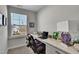 Bright office with a built-in desk, window view, and neutral decor, perfect for a productive workspace at 90 Rigsby Ave, Four Oaks, NC 27524