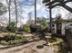 Landscaped backyard featuring stone pathway, storage shed, and garden area at 916 Belhaven Rd, Cary, NC 27513