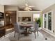 Open dining area with chandelier and a view to the kitchen, with seating for four people at 916 Belhaven Rd, Cary, NC 27513