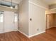 Inviting entryway with hardwood floors, white trim, and a view into the living area at 916 Belhaven Rd, Cary, NC 27513