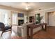 Staged living room showcasing hardwood floors, fireplace, and stylish furniture at 916 Belhaven Rd, Cary, NC 27513