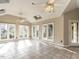 Inviting sunroom with tiled floor, skylights, ceiling fans, and plenty of natural light at 916 Belhaven Rd, Cary, NC 27513