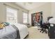 Bright bedroom featuring neutral tones, a cozy bed, and a closet with ample storage space at 9211 Calabria Dr # 117, Raleigh, NC 27617