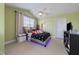 Cheerful bedroom featuring vaulted ceilings, a ceiling fan, and a cozy bed with colorful accents at 9211 Calabria Dr # 117, Raleigh, NC 27617