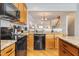 Open concept kitchen featuring modern appliances, granite countertops, and ample cabinet space at 9211 Calabria Dr # 117, Raleigh, NC 27617