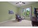 Relaxing bedroom space featuring a comfortable reading chair, ottoman and bright window to view nature at 946 Berry Patch Ln, Pittsboro, NC 27312
