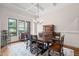 Elegant dining room featuring a coffered ceiling, chandelier, and traditional furniture set at 946 Berry Patch Ln, Pittsboro, NC 27312