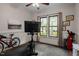Gym featuring a stationary bike with exercise equipment and a window to view nature at 946 Berry Patch Ln, Pittsboro, NC 27312