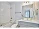 Clean bathroom featuring subway tiles in shower/tub and white vanity with modern fixtures at 1012 Addison Pl, Raleigh, NC 27610