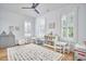 Bright and airy bedroom with play area, white furniture and natural light at 1012 Addison Pl, Raleigh, NC 27610