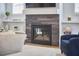 Inviting fireplace with dark wood-look tile surround and built-in shelving, perfect for cozy evenings at 1012 Addison Pl, Raleigh, NC 27610