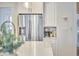 A kitchen showcasing a stainless steel refrigerator and a coffee station with storage for books and beverages at 1012 Addison Pl, Raleigh, NC 27610