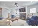 Inviting living room with fireplace and staircase, designed for comfortable living and stylish entertaining at 1012 Addison Pl, Raleigh, NC 27610