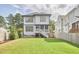 Exterior back view featuring two stories, a back porch and a spacious fenced-in yard at 1016 Addison Pl, Raleigh, NC 27610