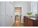 Hallway that provides a view of the modern kitchen with stainless steel appliances at 1016 Addison Pl, Raleigh, NC 27610