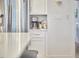 The well-lit kitchen is complete with stainless steel appliances and ample cabinet space at 1016 Addison Pl, Raleigh, NC 27610