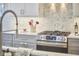 A gourmet kitchen features stainless steel appliances, a sleek countertop, and modern cabinetry at 1016 Addison Pl, Raleigh, NC 27610