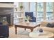 Welcoming living room with a fireplace, deck access, and comfortable seating arrangement at 1016 Addison Pl, Raleigh, NC 27610
