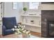 Comfortable living room showcasing a fireplace, blue armchair, and built-in shelves at 1016 Addison Pl, Raleigh, NC 27610
