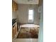 Outdated kitchen with wood cabinets, laminate counters, and a worn floor rug at 1117 S Blount St, Raleigh, NC 27601