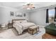 Spacious bedroom featuring neutral walls, carpet, and an overhead fan with a light at 112 E Main St, Micro, NC 27555