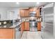 This is a beautiful kitchen with stainless steel appliances, granite countertops, and wood cabinets at 112 E Main St, Micro, NC 27555