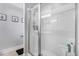 Clean and modern shower features glass enclosure with bench seating and recessed lighting at 112 E Main St, Micro, NC 27555