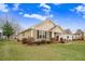 Charming home exterior displaying manicured lawn, complemented by well-placed shrubbery and timeless architectural details at 112 E Main St, Micro, NC 27555