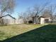 Backyard featuring a storage shed, fenced perimeter, and a neatly maintained lawn at 118 Park Ave, Knightdale, NC 27545