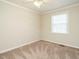 Bedroom featuring carpet, neutral paint and a ceiling fan at 118 Park Ave, Knightdale, NC 27545