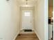 Inviting foyer with tiled and hardwood floors, leading to a bright interior at 118 Park Ave, Knightdale, NC 27545