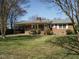 Classic brick home with covered porch and neatly manicured front lawn at 118 Park Ave, Knightdale, NC 27545