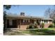 Charming single-story brick home featuring a well-maintained lawn and covered carport at 118 Park Ave, Knightdale, NC 27545
