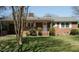 Charming single-story brick home featuring a well-maintained lawn and covered carport at 118 Park Ave, Knightdale, NC 27545