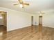 Expansive living room with hardwood flooring, offering multiple access points at 118 Park Ave, Knightdale, NC 27545