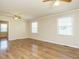 Spacious living room with hardwood floors, neutral paint, and ample natural light at 118 Park Ave, Knightdale, NC 27545